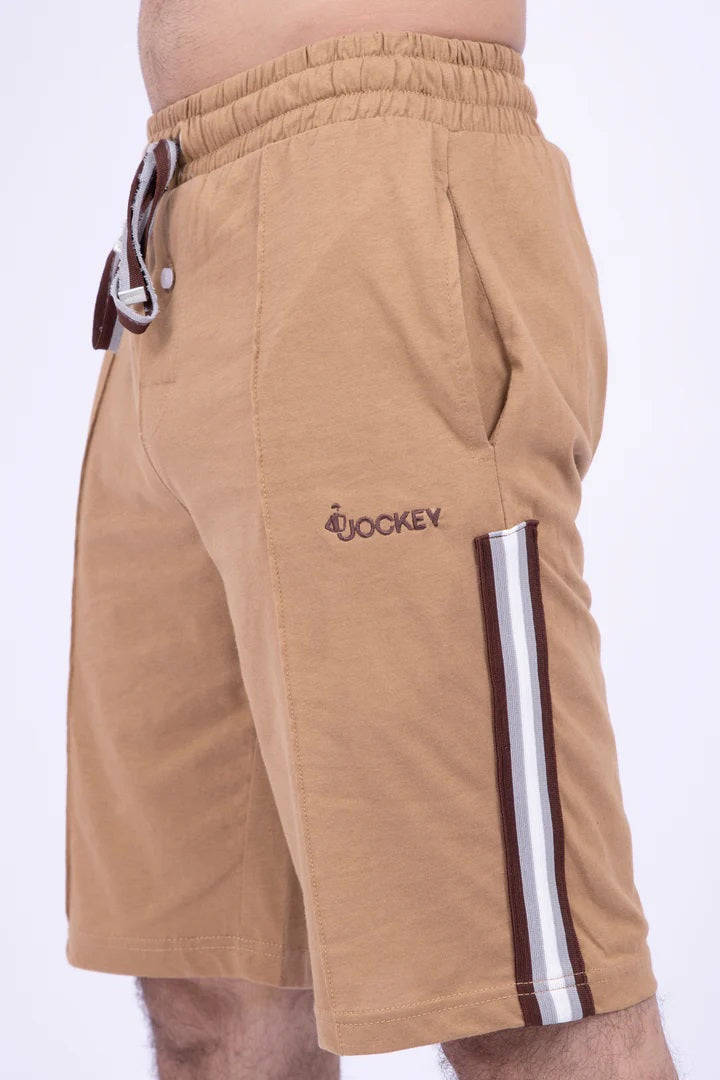 Tan shorts with a visible brand logo on a white background