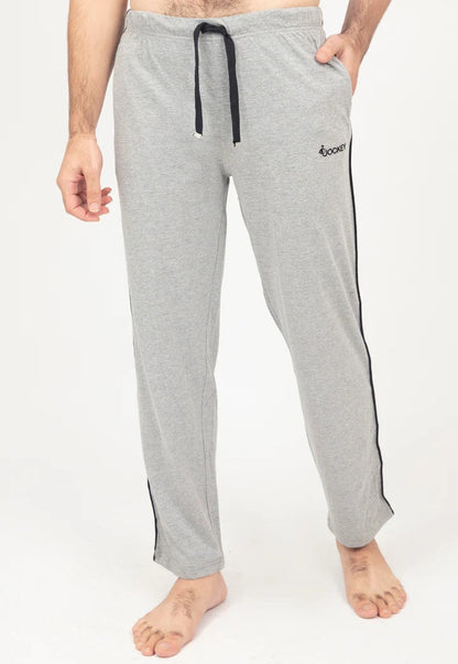Gray pajama pants with a black drawstring and side stripe on a white background