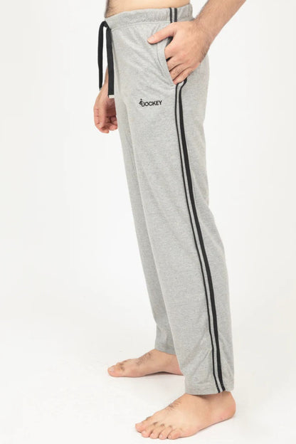 Gray sweatpants with black stripes and a brand logo on a white background