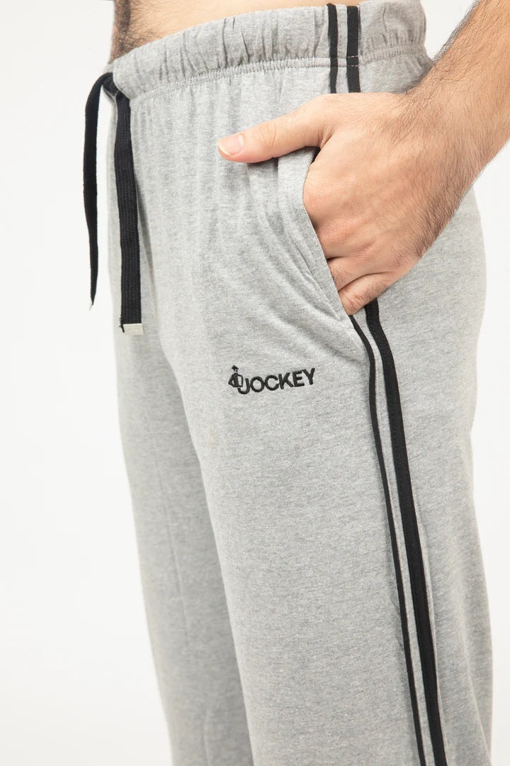 Gray sweatpants with black stripes and a logo on a white background